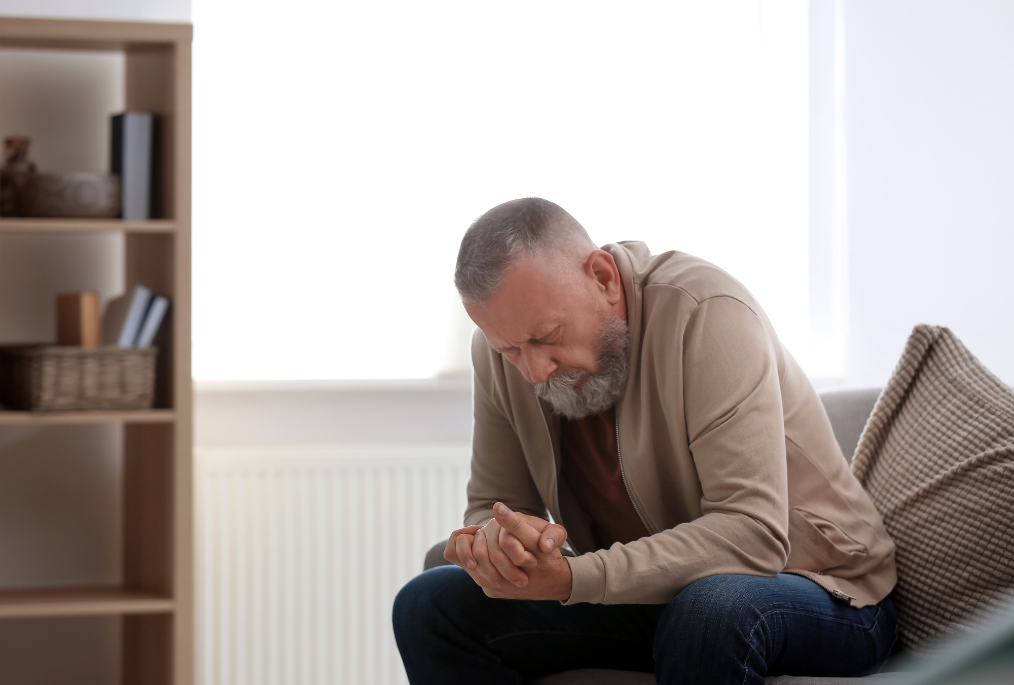 Депрессия у мужчин после 50. Man sitting on Sofa back view. Dead old man sitting on Sofa. Elder abuse - Raynes Erickson attorneys at Law.